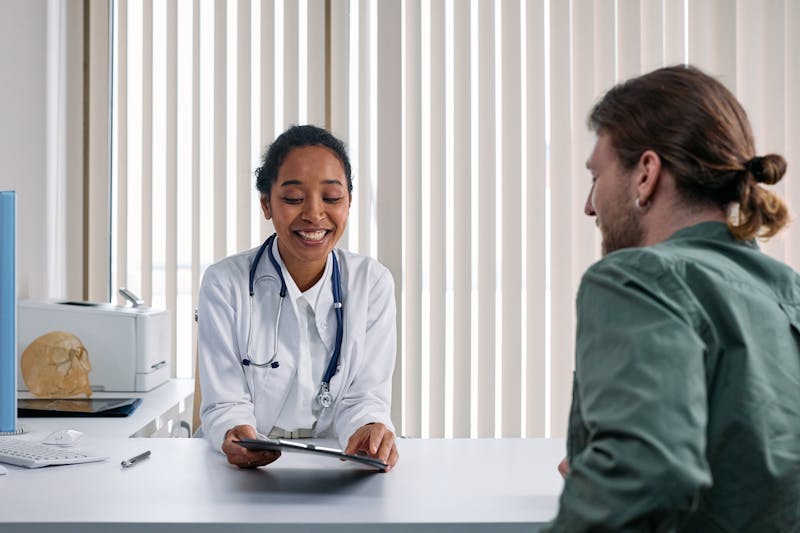Doctor reviewing lab test results with patient